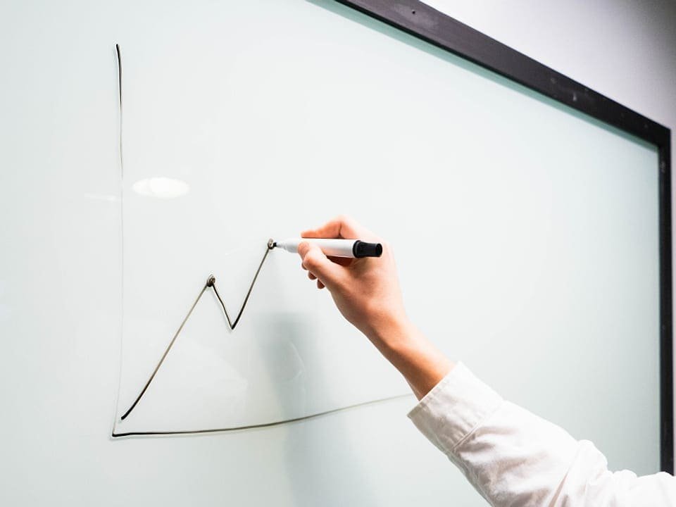 Instructor mapping out continuing-education topics on a whiteboard