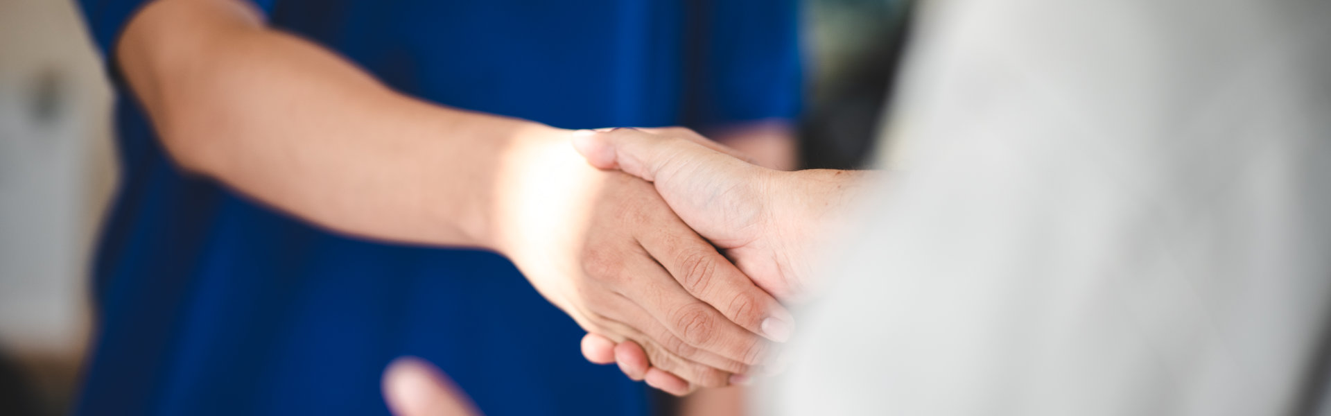 women shaking hands